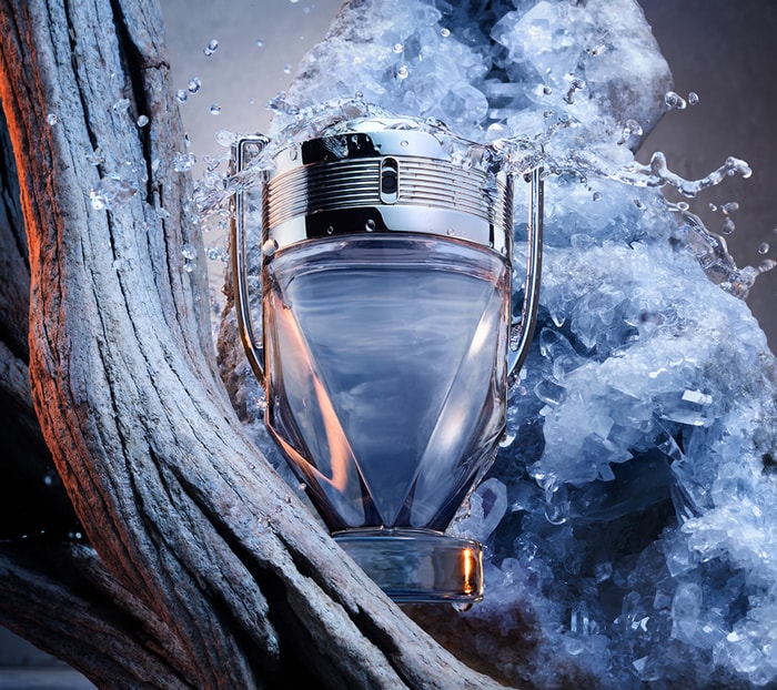 Perfume bottle with ice and water elements