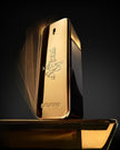 Gold perfume bottle with 'One Million' branding on a reflective surface.
