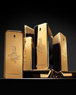 Gold perfume bottles with '1 Million' branding on a black background