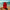 Red thermos with 'Odyssey Artista' branding on a sandy beach with ocean in the background