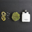 Perfume bottle labeled 'Legend Spirit' with decorative elements on a dark surface
