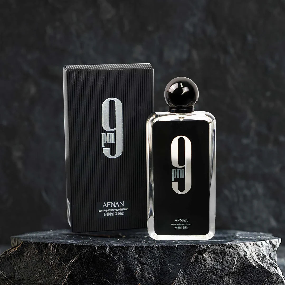 Afnan 9 perfume bottle and packaging on a dark background