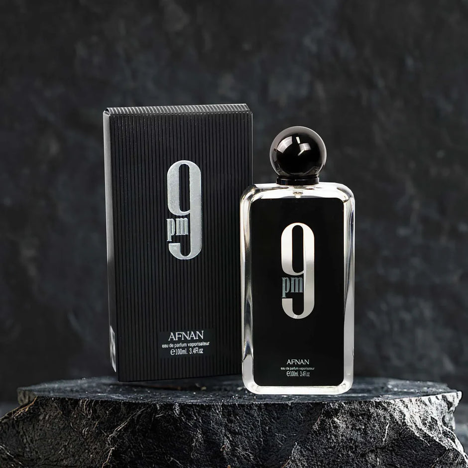 Afnan 9 perfume bottle and packaging on a dark background