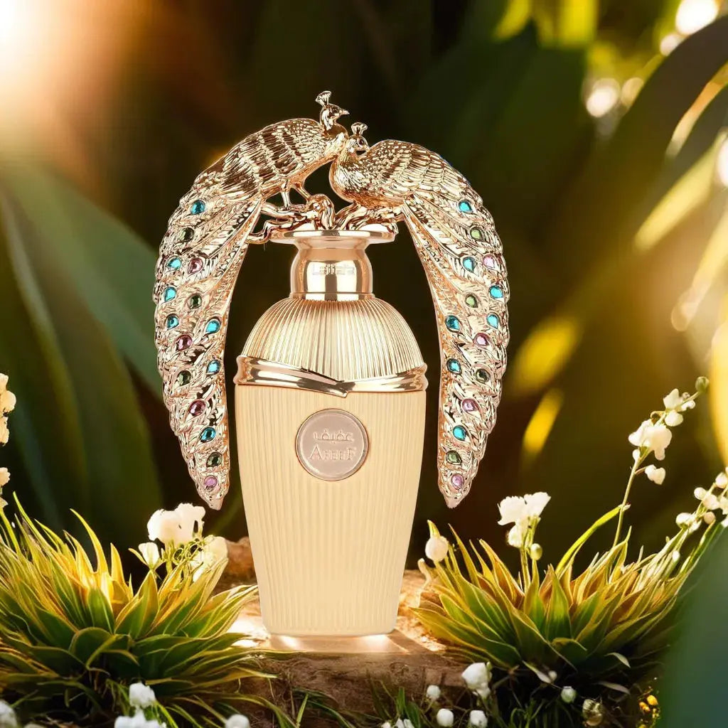 Decorative perfume bottle with peacock design on a natural background