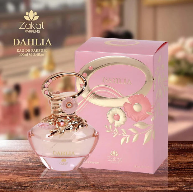 Zakat Parfums Dahlia perfume bottle and packaging on a wooden surface with blurred background