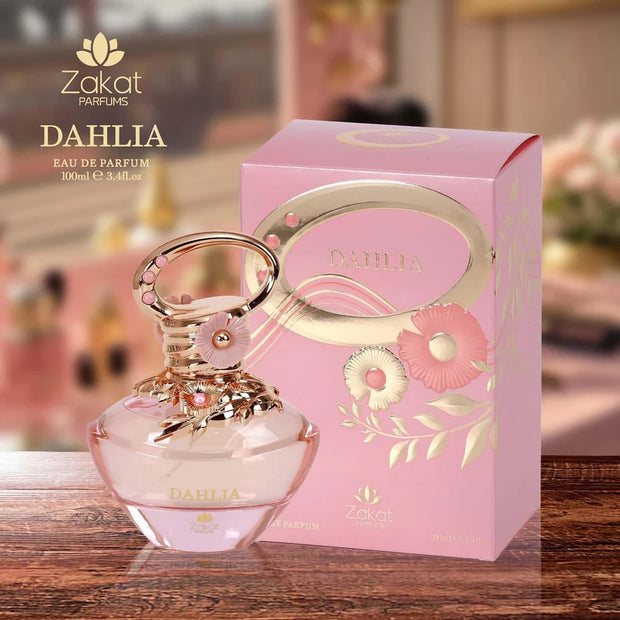 Zakat Parfums Dahlia perfume bottle and packaging on a wooden surface with blurred background