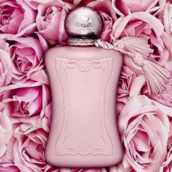 Pink perfume bottle on a bed of pink roses