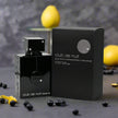 Black perfume bottle and packaging labeled 'club de nuit intense' on a dark surface with lemons in the background.