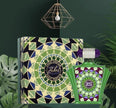 Zalat Parfum bottle and packaging with geometric design on a dark green background