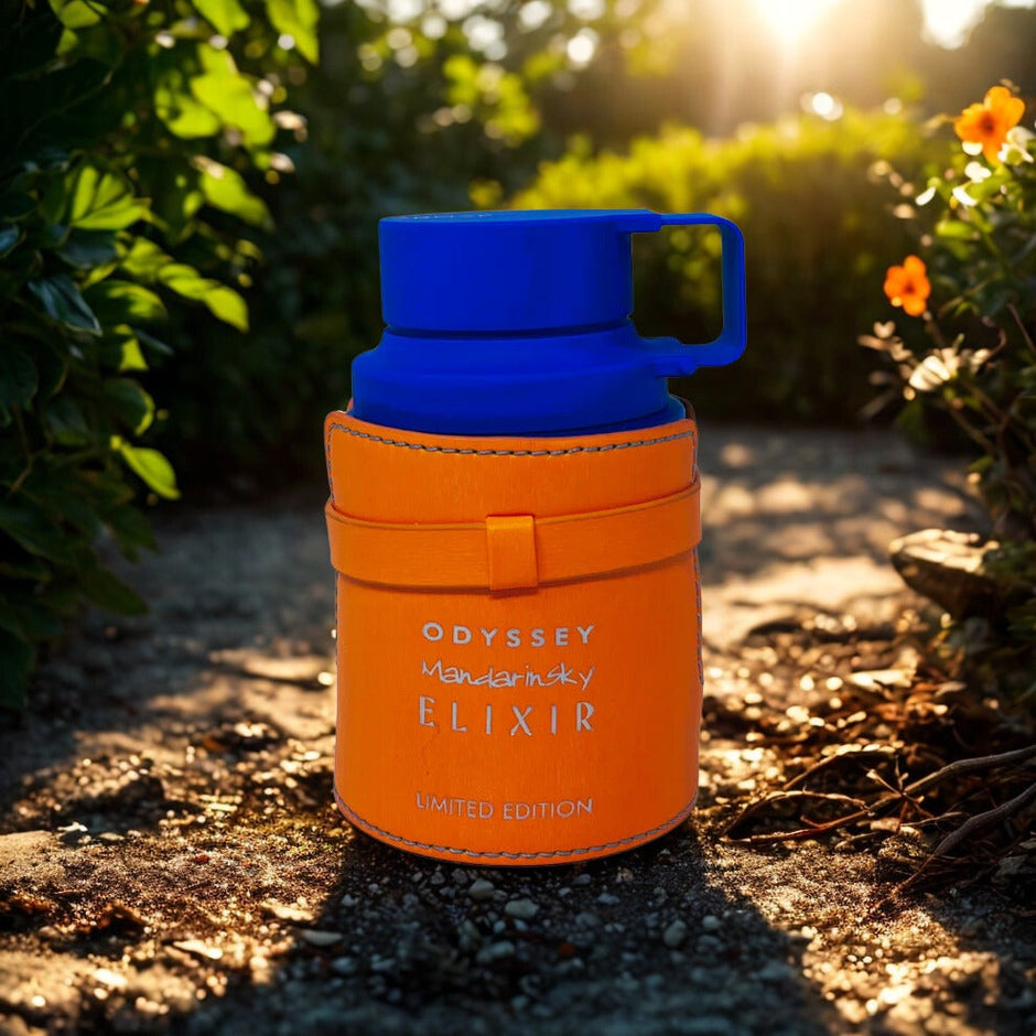 Orange thermos with blue lid on a natural background