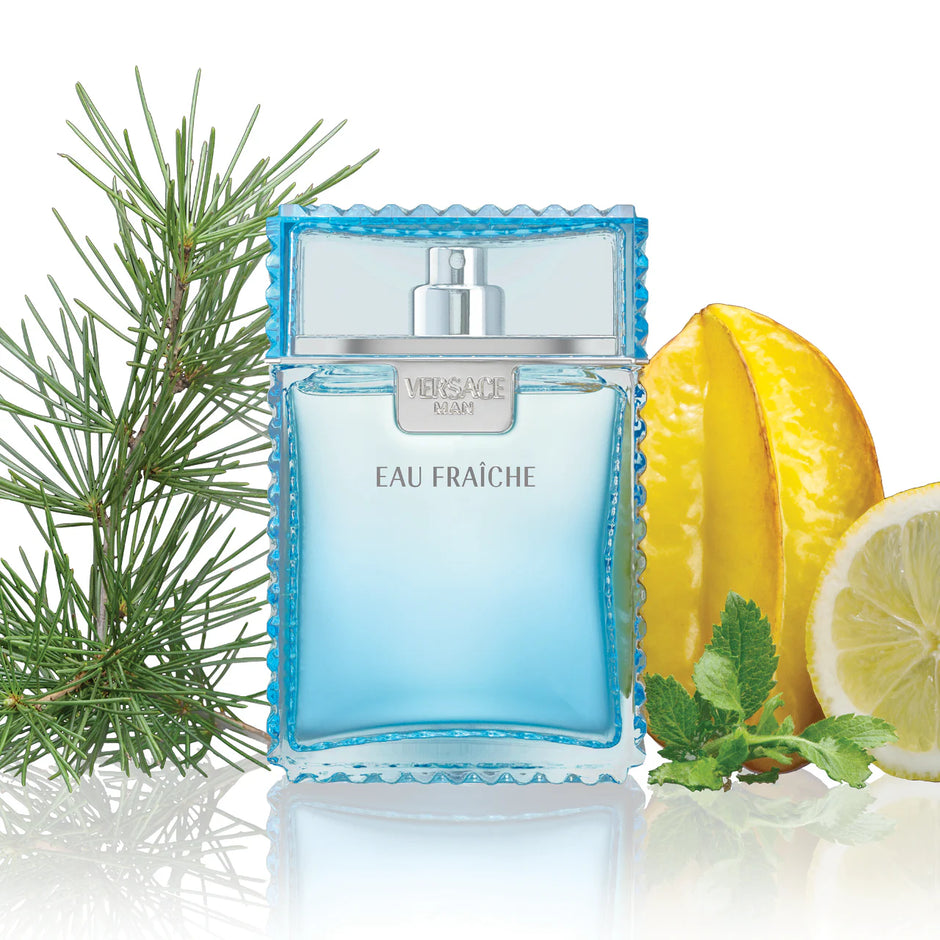 Blue perfume bottle labeled 'Eau Fraçèche' with a lemon and starfruit on a white background