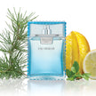 Blue perfume bottle labeled 'Eau Fraçèche' with a lemon and starfruit on a white background