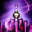 Bottle of alcohol with pink cap surrounded by pink glasses on a purple background