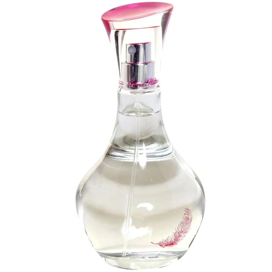 Clear perfume bottle with pink cap on a white background