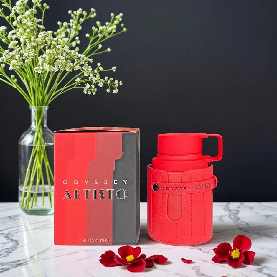 Red Odyssey Artisto mug with packaging and flowers on a dark background