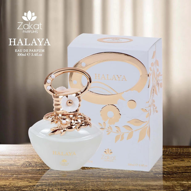 Zakat Parfums Halaya perfume bottle and packaging on a wooden surface with a neutral background
